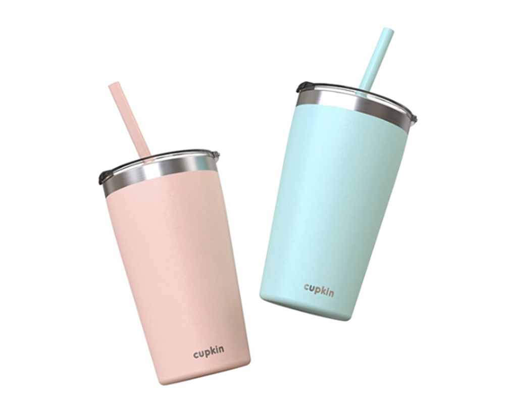 Two pastel-colored tumblers with straws. One is soft pink, the other light blue. Both have metal rims and the brand name 