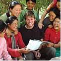 group-of-smiling-people-looking-at-book.png
