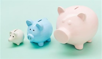 Three piggy banks: one small white, one medium blue, one large pink