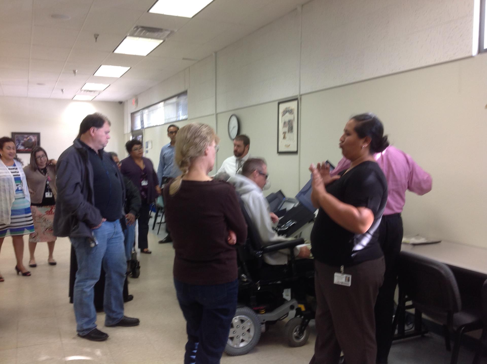 Image of a sign language interpreter at a VAAC meeting