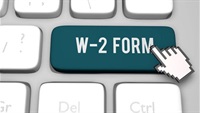 keyboard with a finger pointed to key that states W-2 Form