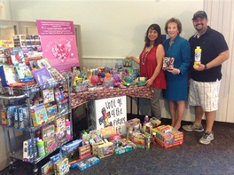1094-Autism-Awareness-volunteers-with-table-of-toys.jpeg